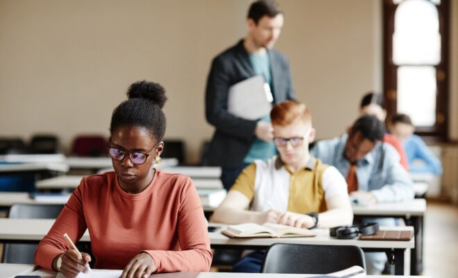 How Can you Stay Organized During Exam Season, and Why is it so Important for healthcare students? 1 A group of people in a classroom Description automatically generated with medium confidence
